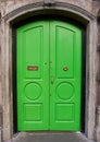 View of brightly colored traditional English green house door. Entrance door Royalty Free Stock Photo