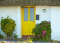 View of brightly Irish house front with traditional colored england entrance door. Royalty Free Stock Photo