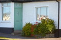 View of brightly Irish house front with traditional colored england entrance door. Royalty Free Stock Photo