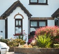 View of brightly Irish house front with traditional colored england entrance door. Royalty Free Stock Photo