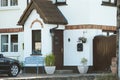 View of brightly Irish house front with traditional colored england entrance door. Royalty Free Stock Photo