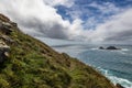A view of The Brisons off the Cornish coast, with clouds rolling in off the ocean Royalty Free Stock Photo