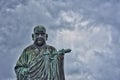 A view of the bronze statue of Nichiren Shonin a founder of Nichiren Buddhism School  in japan Royalty Free Stock Photo