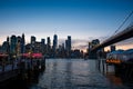 View of the Brooklyn bridge during a dusk from East river. Royalty Free Stock Photo