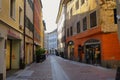 View of Brunico village promenade with its coloful houses and shops in the historic center of Brunico, Alto Adige, Italy