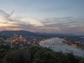 view of the of buda castle, chain bridge and danube river at dusk from citadella in budapest Royalty Free Stock Photo