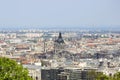 View on Budapest from Gellert Hill, Hungary. Houses, the Basilica of St. Stephen in the background of the foggy morning sky