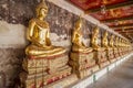 View at the Buddha statues in Wat Suthat Thepwararam Ratchaworamahawihan in Bangkok, Thailand