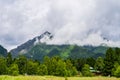 View of a Buddhist datsan in a village against the background of mountains on a sunny summer day. Summer trip.