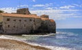 View of Budva Old Town Citadel and the Adriatic Sea from Richard s Head beach in Montenegro, Balkans on a sunny day Royalty Free Stock Photo