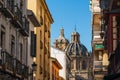 View of the building of the Basilica of Saints Justus and Pastor with street view, Granada, Andalusia, Spain Royalty Free Stock Photo