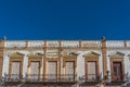 View of the building facade against the blue sky, Ronda, Province Malaga, Andalusia, Spain. Copy space for text