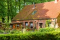 View of the building among the forest, Hooksiel, Wangerland, Germany. Royalty Free Stock Photo