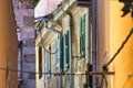 View of a building from a narrow alley way with windows Royalty Free Stock Photo