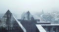 A view of a building with three triangular shaped roofs, AI