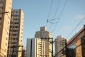 View of a building, trees and electricity poles on a street in the city of Salvador, Bahia Royalty Free Stock Photo