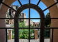 View on buildings of old Montserrat monastery through vintage window Royalty Free Stock Photo