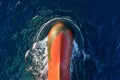 View of the bulbous bow of cargo ship, sailing through the ocean.