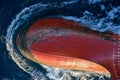 View of the bulbous bow of cargo ship, sailing through the ocean. Royalty Free Stock Photo