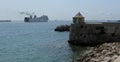 View of a bulwark in the port of the tourist city of Ibiza and the sea