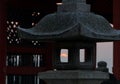 The view of sunset through the fire box (hibukuro) of the stone lantern. Japan Royalty Free Stock Photo