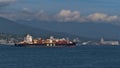 View of Burrard Inlet near Vancouver with container ship operated by Mediterranean Shipping Company (MSC) passing by. Royalty Free Stock Photo