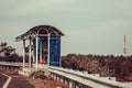 View of bus stop with shelter from sun along east coast road, Chennai, India. Selective focus Royalty Free Stock Photo