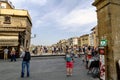 View of the businesses located to the sides of the Bridge on the river Arno, called `Ponte Vecchio` with people walking