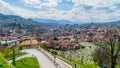 View of bustling Sarajevo cityscape nestled in the foothills of a majestic mountain range