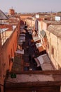 View of a busy and crowdy street in Marrakesh, Marocco surrounded by orange buildings