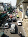 View of busy street, street market, sky train rail