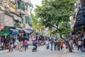 View of busy traffic with many motorbikes and vehicles in Hanoi Old Quarter, capital of Vietnam. Royalty Free Stock Photo