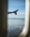 View from cabin of airplane.Through the window. Plane photography above clouds and mountains. Royalty Free Stock Photo