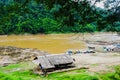 View of cabin, the local boat, mountain and forest beside Salween River