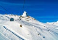 View of cable cars to the snow covered Klein Matterhorn Peak Sta