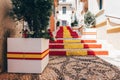 View of Calpe old town on sunny day. Stairs adorned with colors of Spanish flag, Calpe, Alicante province, Valencian Royalty Free Stock Photo