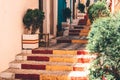 View of Calpe old town on sunny day. Stairs adorned with colors of Spanish flag, Calpe, Alicante province, Valencian Royalty Free Stock Photo