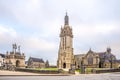 View at the Calvary and Church of Saint Germain in the streets of Pleyben - France Royalty Free Stock Photo