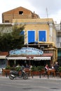 A view of Calymnos Island and a traditional cafe by the harbour in Dodakenes Islands, Greece