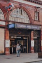 View of Camden Town Underground station, London, UK, man wearing face mask walking out