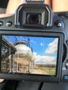 The view of the camera with the photograph is a large round shiny metallic high-pressure container sturdy with pipes