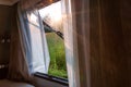 View from camper window to sunny landscape