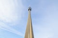 View of the Canadian National Tower CN Tower from its bottom during a sunny afternoon.