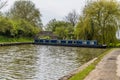 A view of a canal boat manouvering on the Grand Union Canal at Long Buckby Wharf Royalty Free Stock Photo