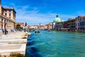 View of the canal with boats and gondolas in Venice, Italy. Venice is a popular tourist destination of Europe Royalty Free Stock Photo