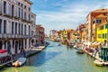 View of the canal with boats and gondolas in Venice, Italy. Venice is a popular tourist destination of Europe Royalty Free Stock Photo