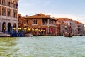 View of the canal with boats and gondolas in Venice, Italy. Venice is a popular tourist destination of Europe Royalty Free Stock Photo