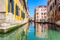 View of the canal with boats and gondolas in Venice, Italy. Venice is a popular tourist destination of Europe Royalty Free Stock Photo