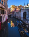 View of a Canal with boats and gondolas in Venice, Italy. Venice is a popular tourist destination of Europe. Royalty Free Stock Photo