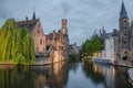 Beautiful canal and traditional houses at dusk in the old town of Bruges Brugge, Belgium Royalty Free Stock Photo